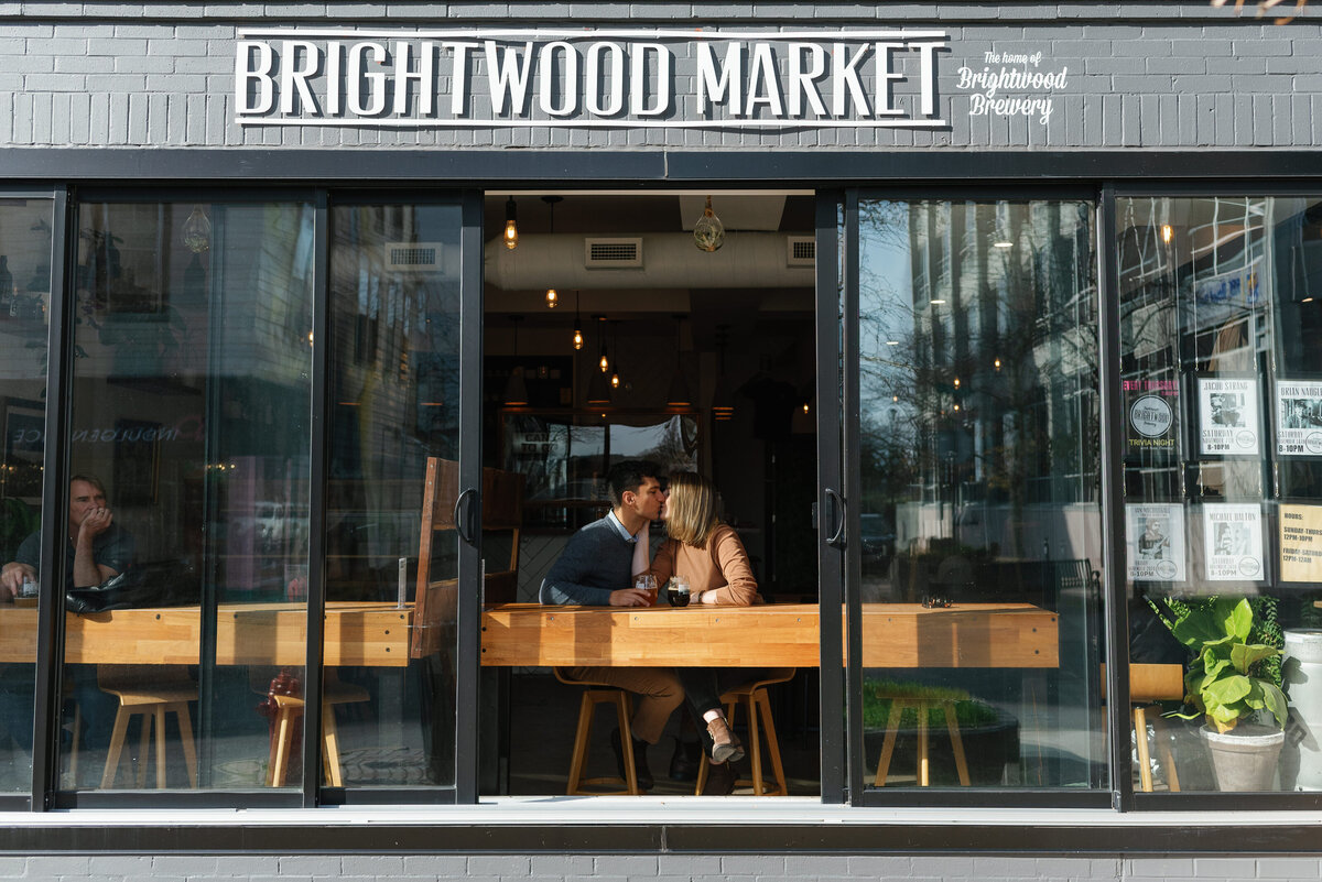 Couple enjoys beer at brightwood brewery for their engagement session