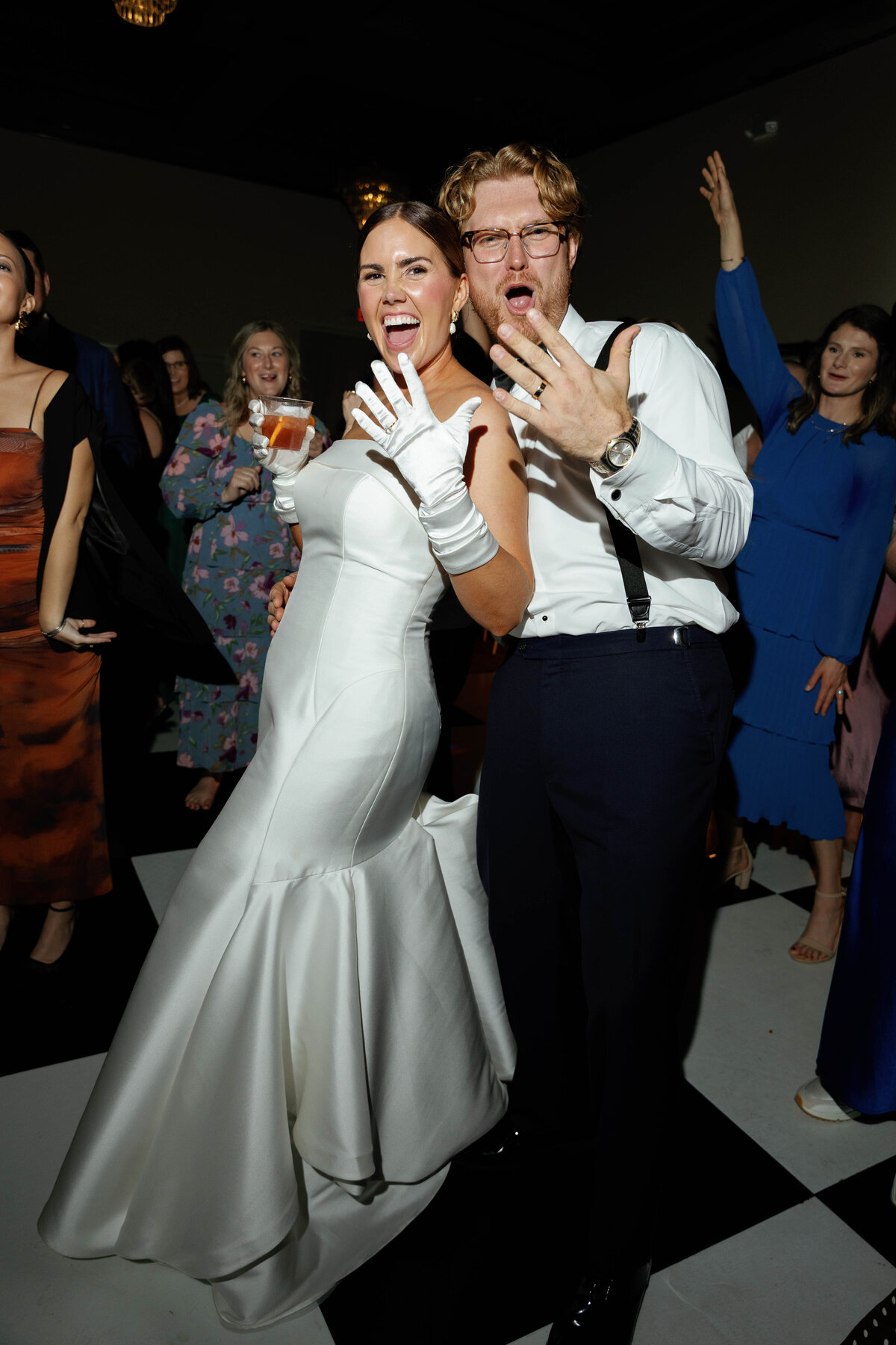 Bride and groom celebrating on dance floor after wedding ceremony