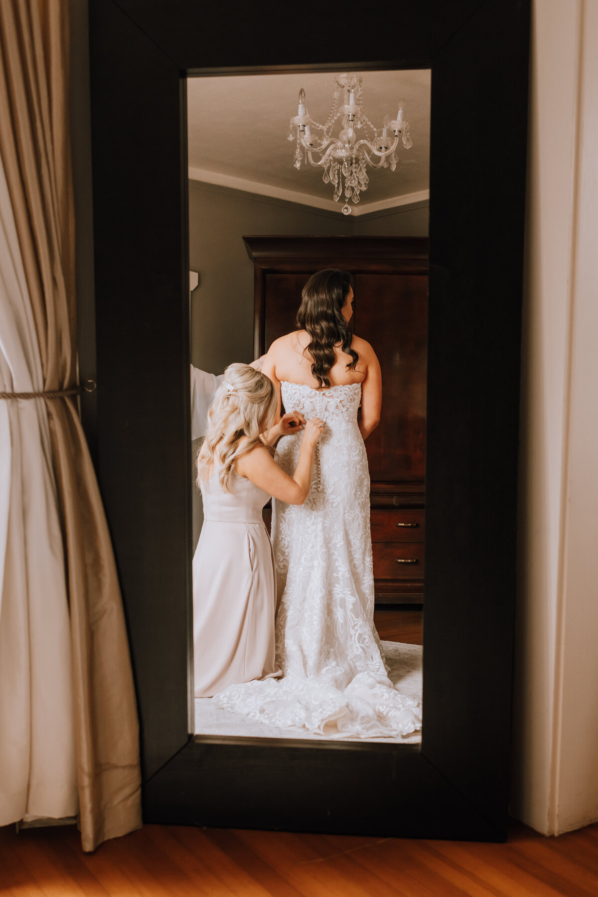 bride getting dressed at manor house