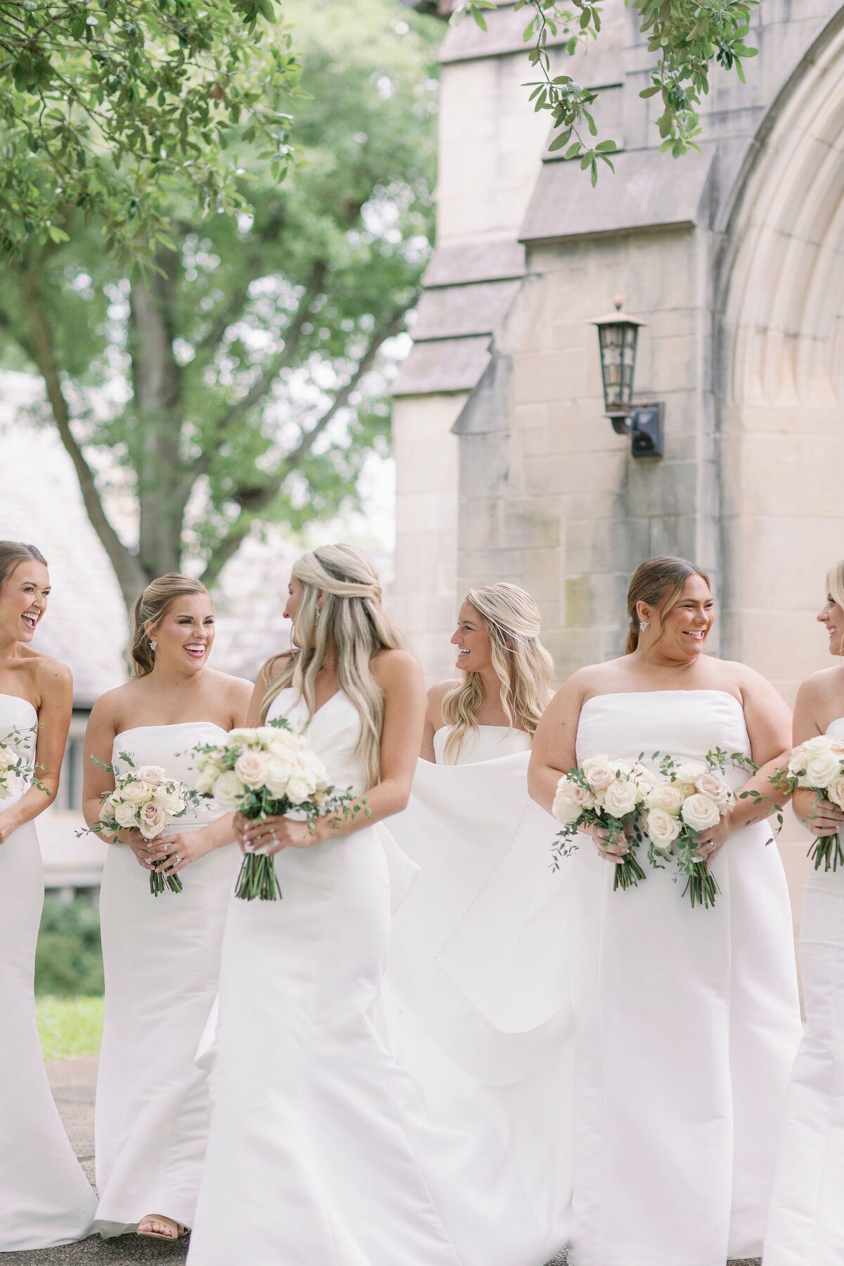 Bride smiling at bridesmaids