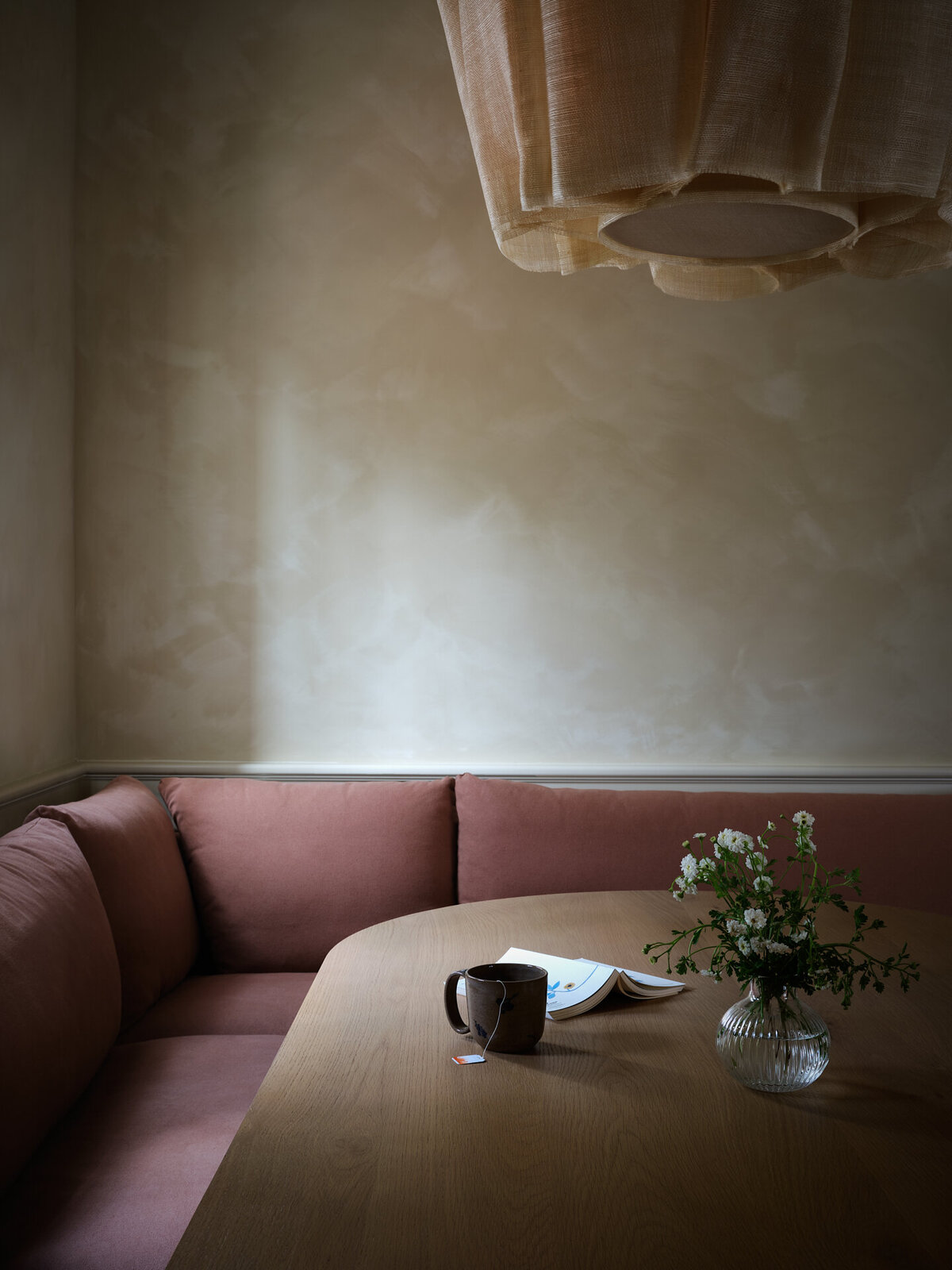 house-franc-hillside-hideaway-movie-theater-kitchenette-laundry-room-remodel-renovation-jamie-sigler-home-limewash-walls-white-oak-table-six-penny-banquette-pinch-london-anders-light-floral-pottery-moody-interiors-austin-texas