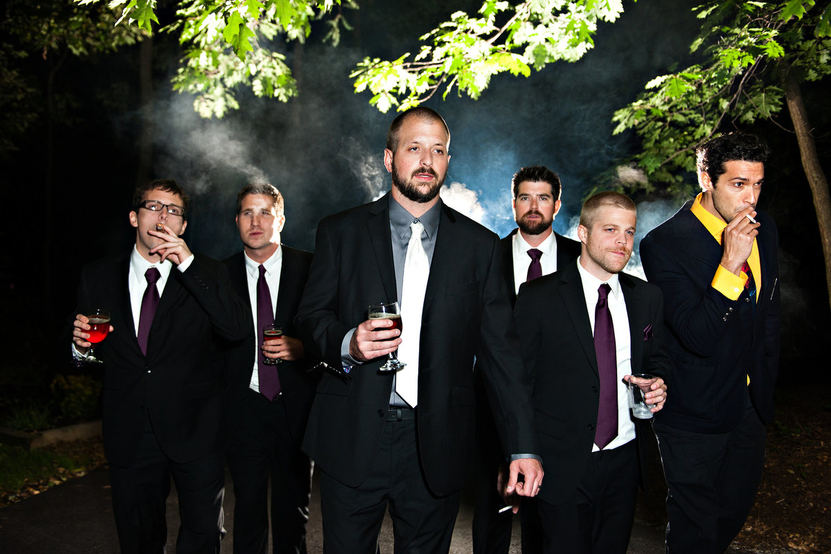 A groom and his groomsmen smoke cigars after this beautiful Lehigh Valley Wedding.