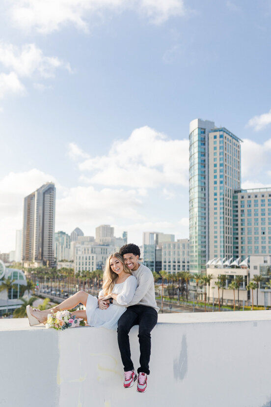couple-sitting-with-downtown-san-diego-in-background