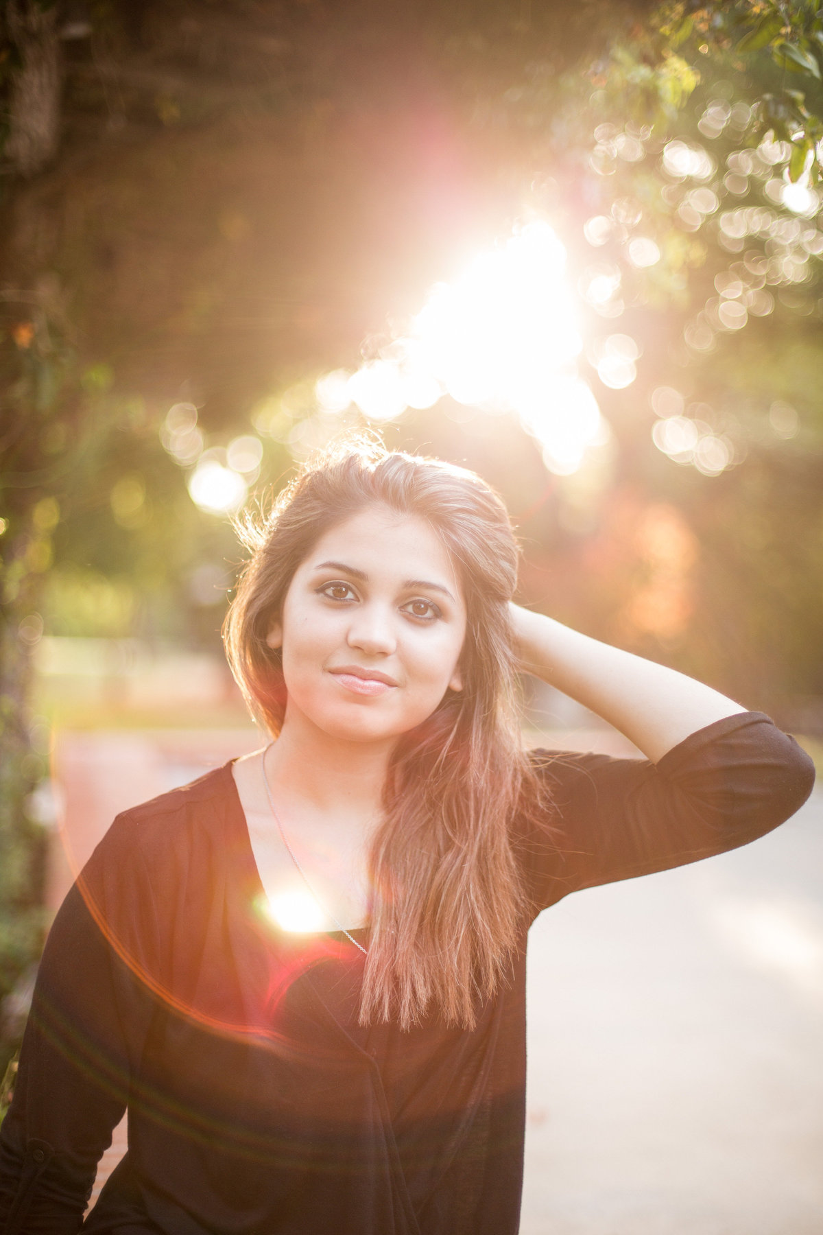 portrait of a girl with sun behind her for family photo session by San Antonio photographer Expose The Heart
