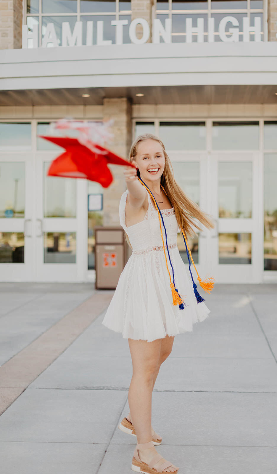 woman throwing graduation cap