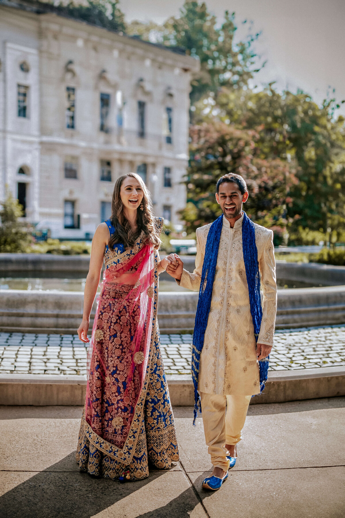 happy-indian-bride-and-groom-laughing-at-their-south-asian-fusion-wedding