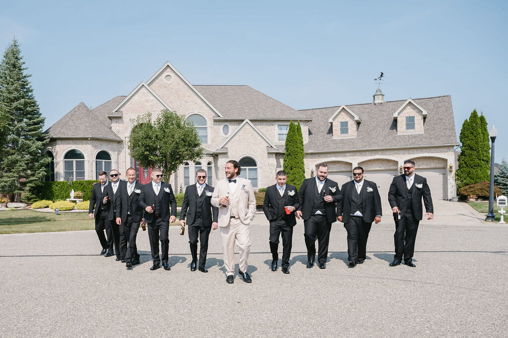 groomsmen in suits walking in Washington Michigan