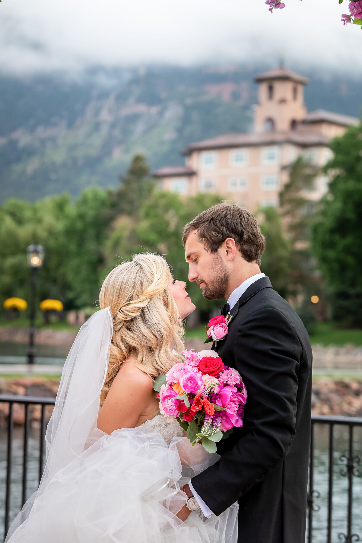 bride and groom embrace at the Broadmoor