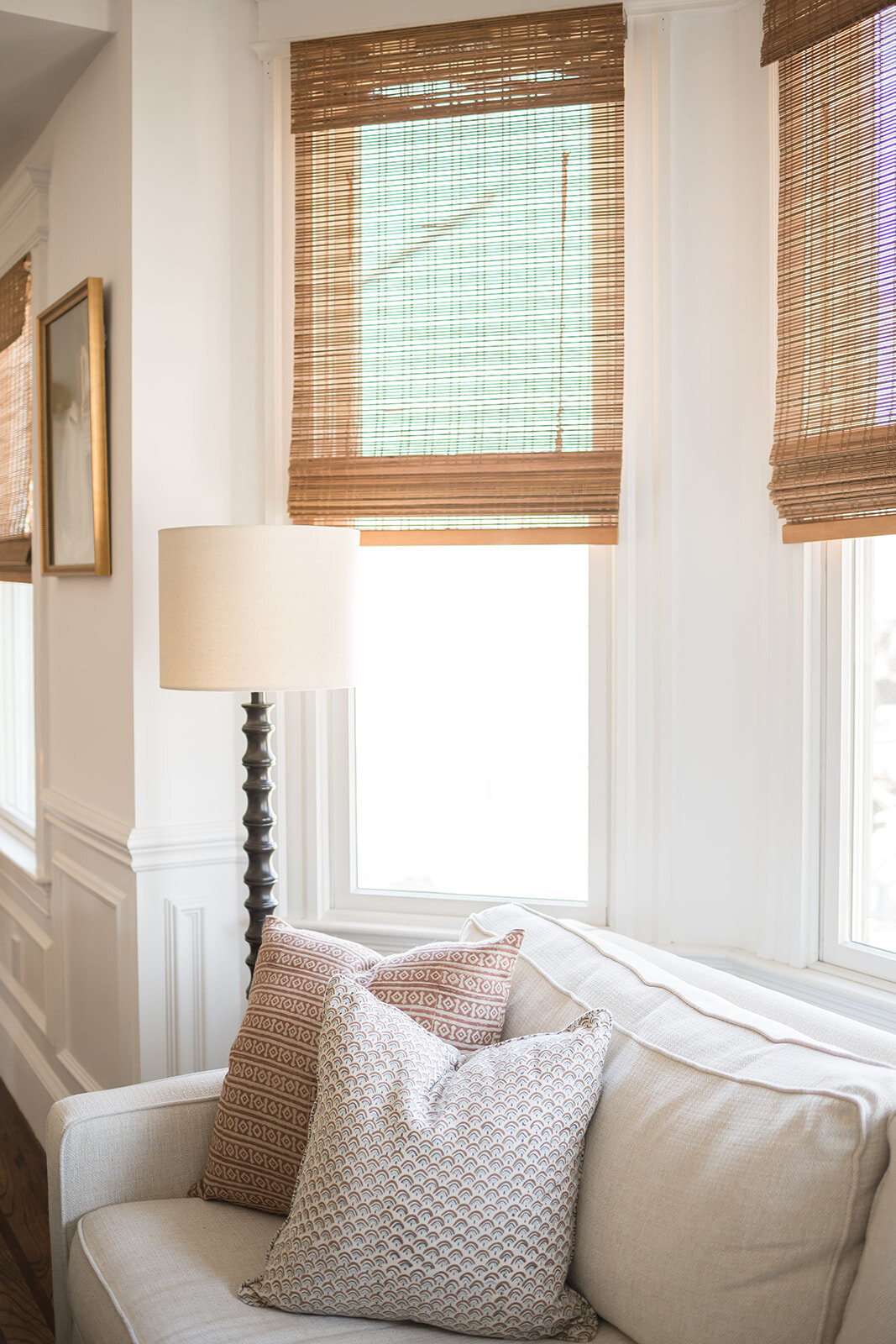 melinda chesson interiors boston baywindow with couch and floor lamp