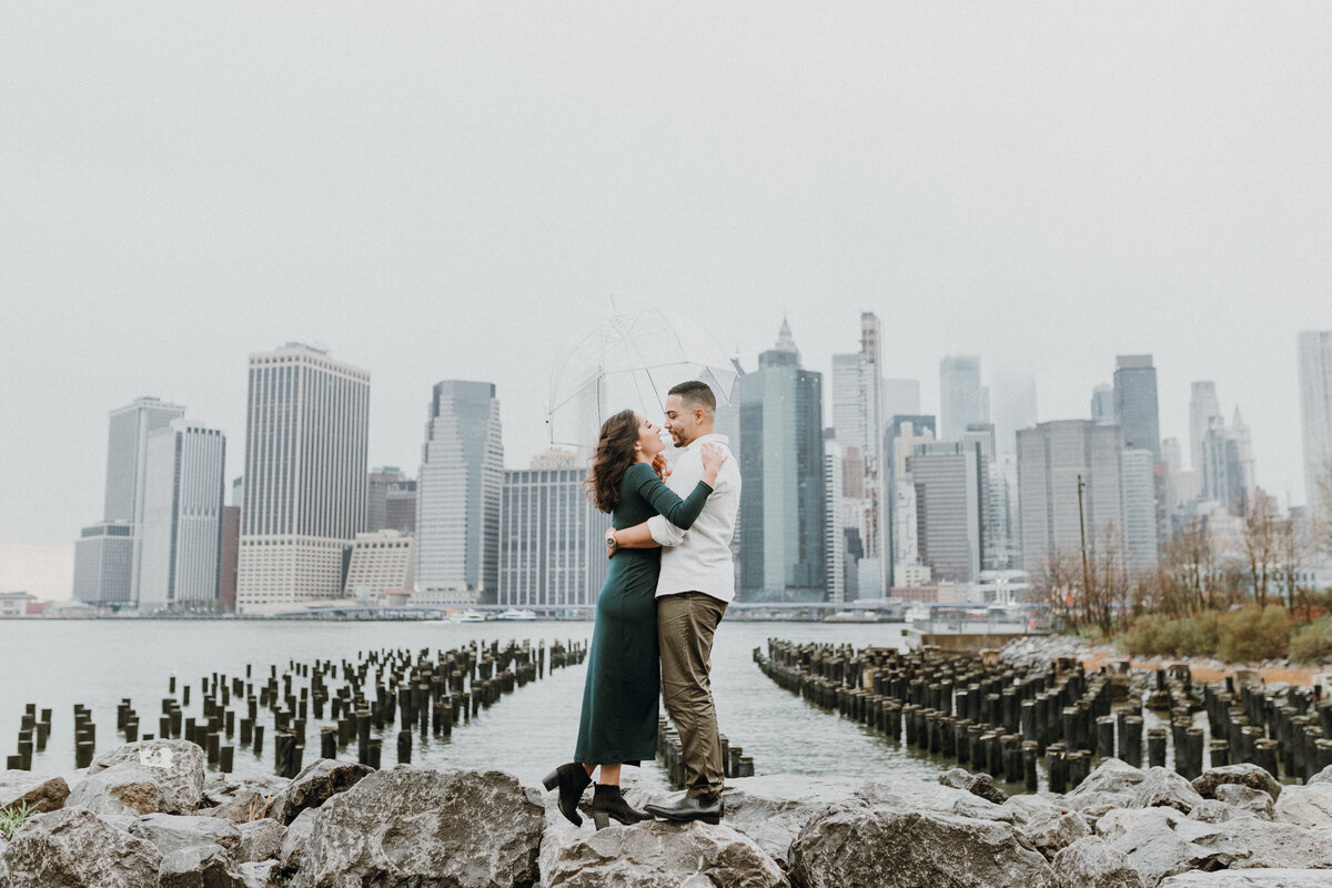 Couple standing and hugging each other in front of the San Fransisco Skyline