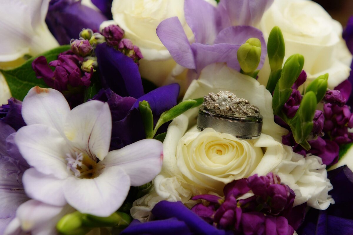 close-up-photo-of-wedding-bouquet-and-engagment-rings