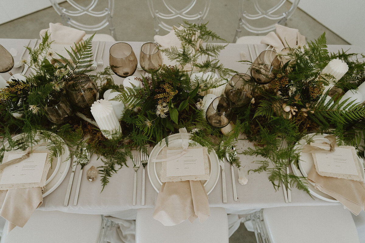 luxury wedding tablescape in greens and earth tones