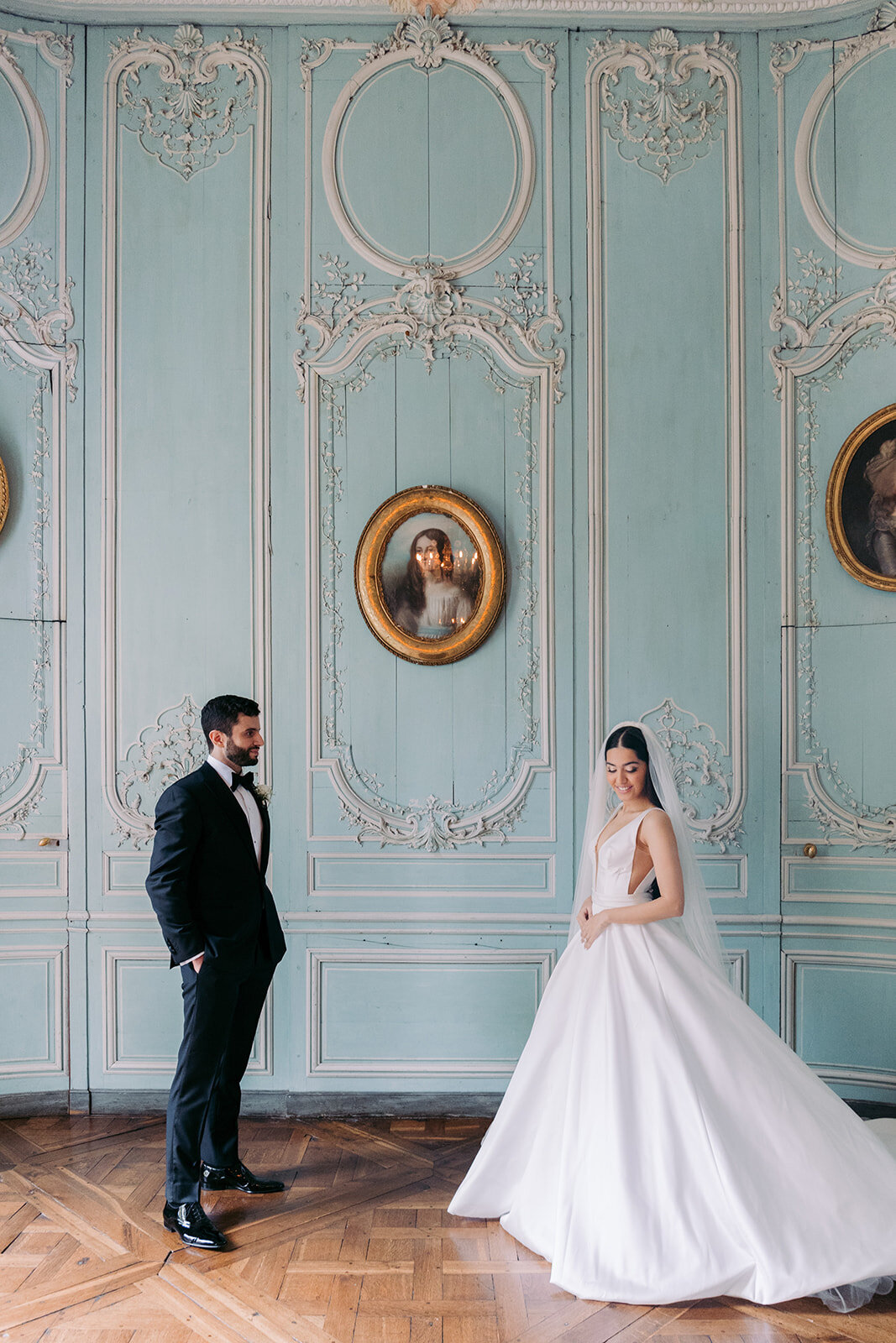 Bride and groom facing each other 