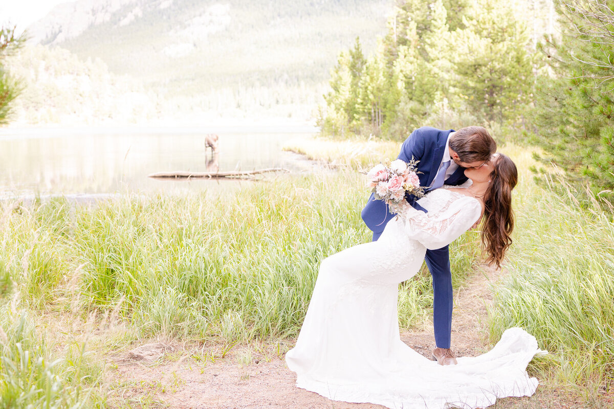 Couple kissing by lake