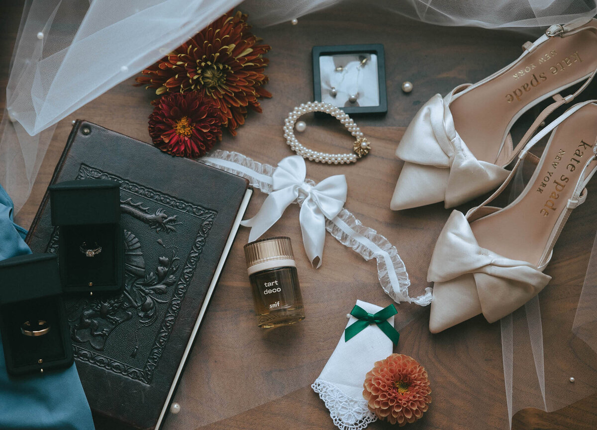 Fall wedding details including jewelry, perfume, shoes and more representing the aesthetic of this client's wedding. 
