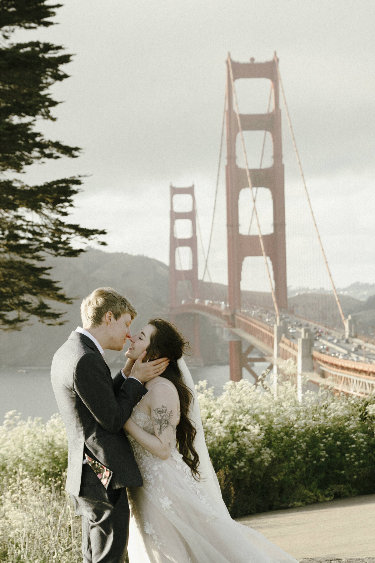 Bride and Groom at Marshall's Beach in San Francisco, California at sunset
