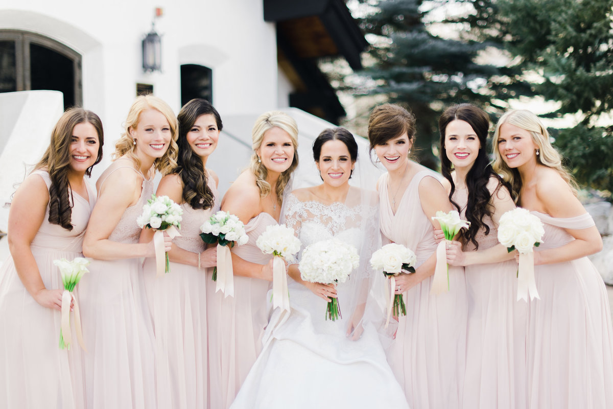We love ladies in soft blush and what could be a better backdrop than the cute Vail Chapel.