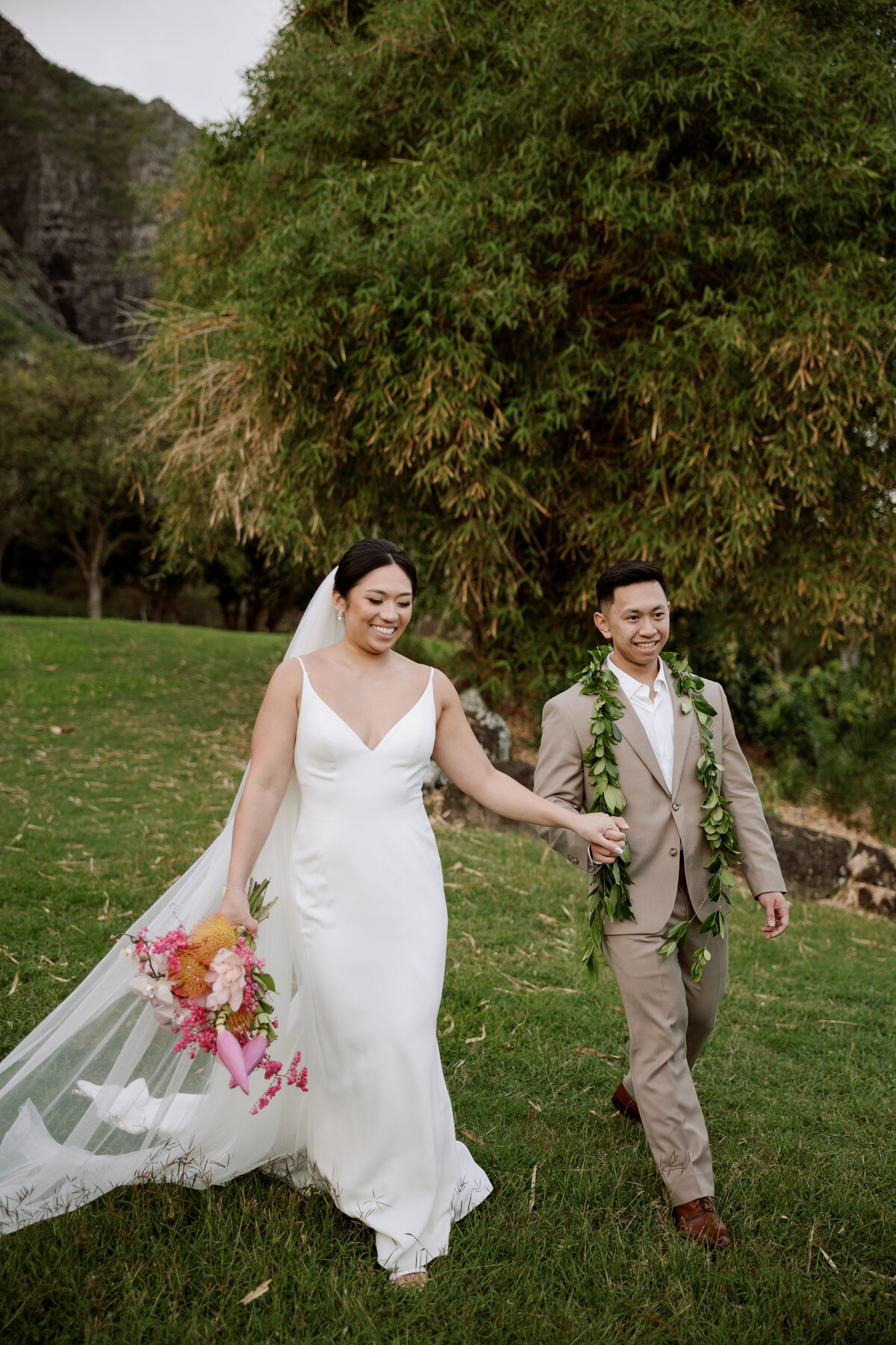 Happy couple walking hand in hand, captured in a candid wedding photography style — Carmel wedding photography by Kate Winters Photography.