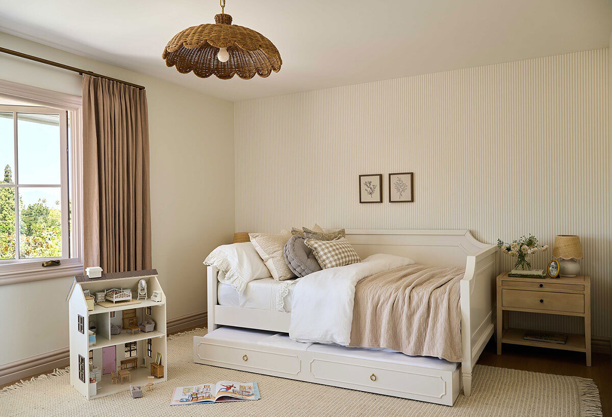 Natural materials and personalized details with patterned wallpaper in Orange County bedroom design