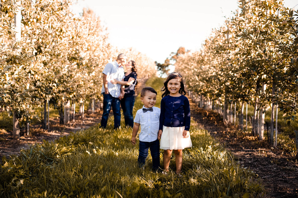 Family in apple orchard for Toronto family photography