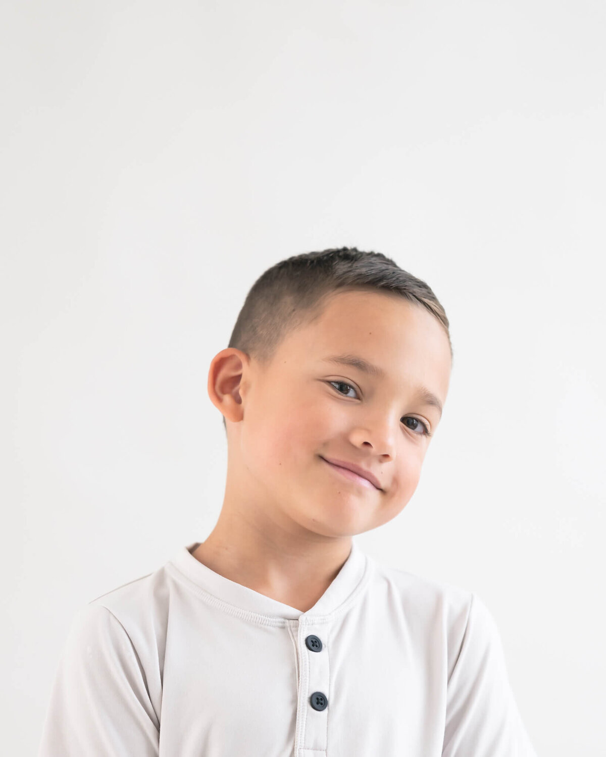 stupio portrait of elementary aged boy with a smrik on his face