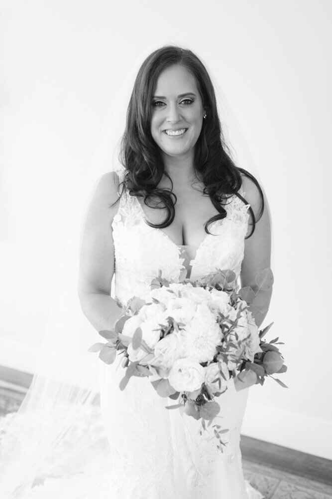 black and white portrait of bride with bouquet -candlelight farms inn wedding