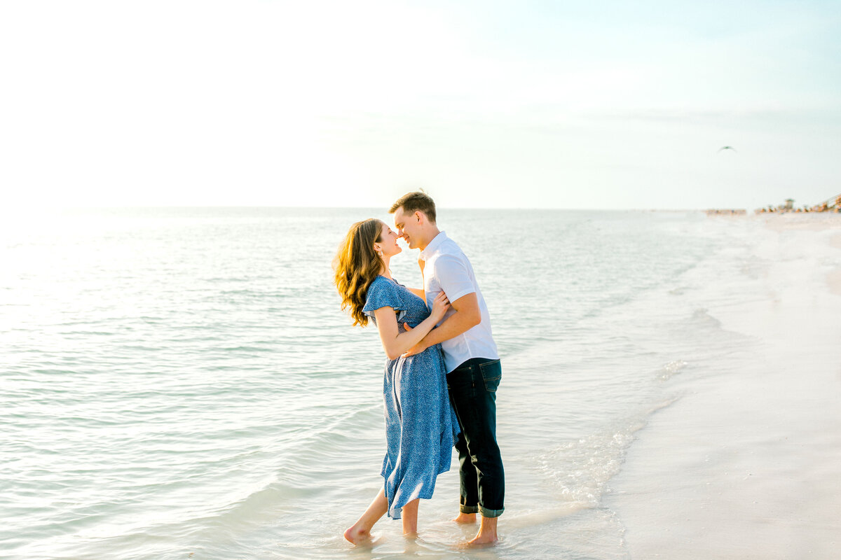 engaged couple for photos at lido key beach in florida