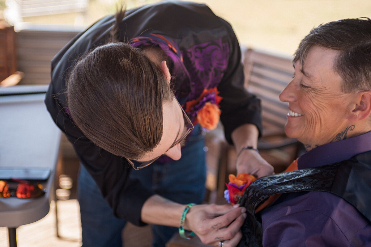 Couple holding hands walking in forest"