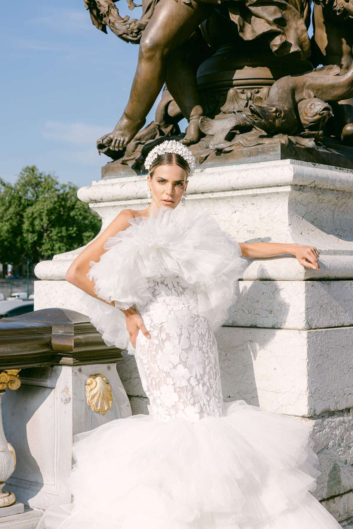 A wedding photo of a bride in her white dress in the streets of Paris in France.