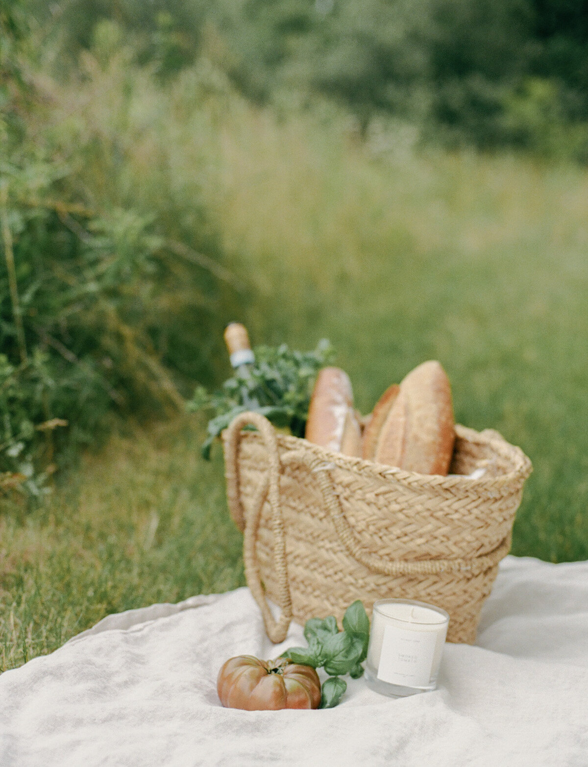 straw market tote with bread baguette, batard, Detroit Rose smoked tomato candle branding lifestyle candle photo