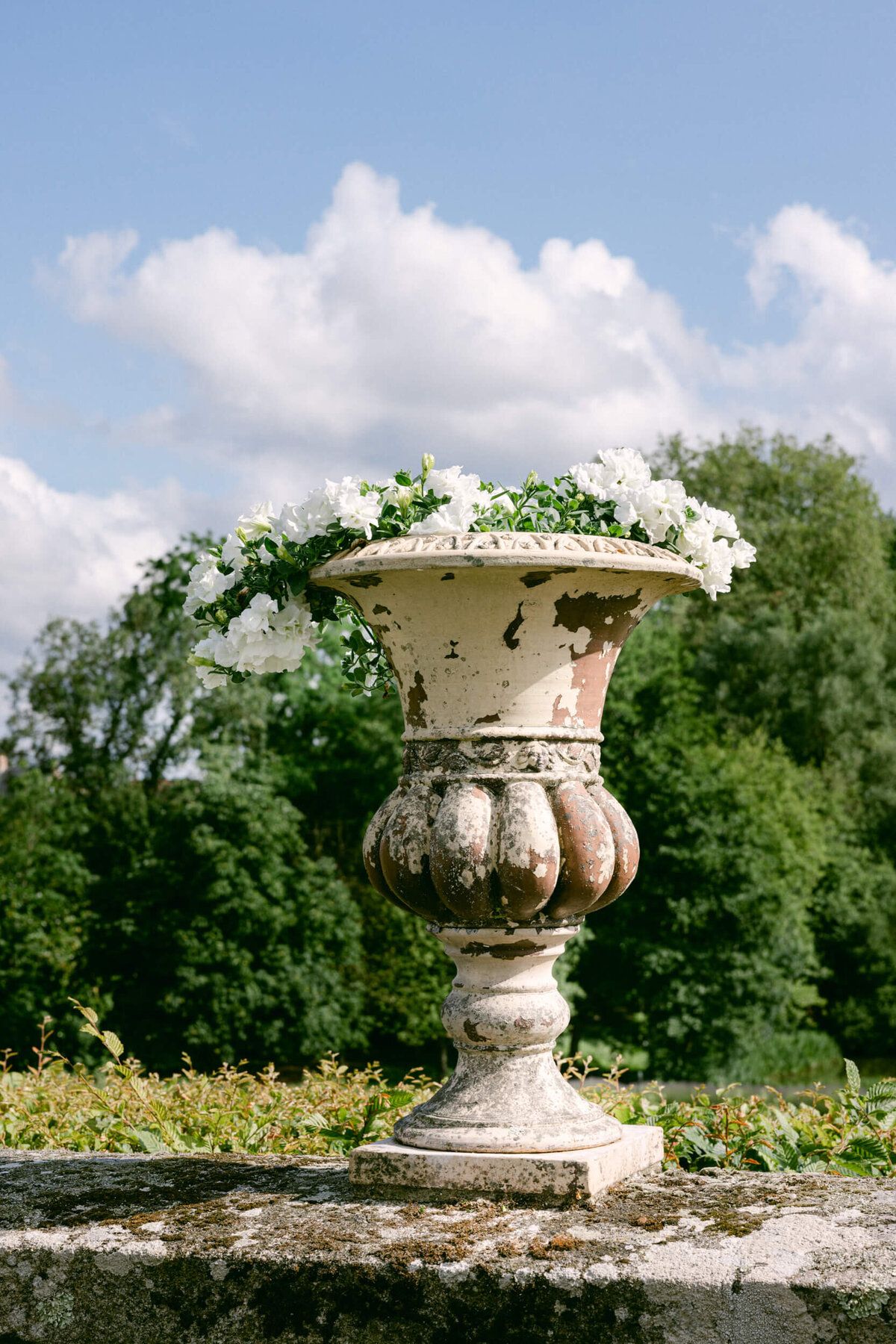 A wedding photo of a floral vase at Chateau Du Grand Luce in France