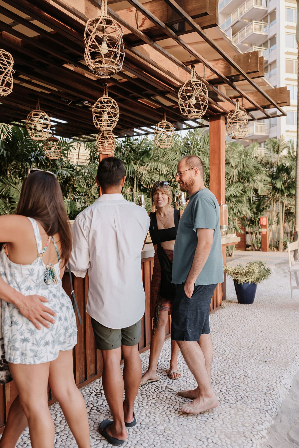 Wedding guests at the bar  at post wedding pool party