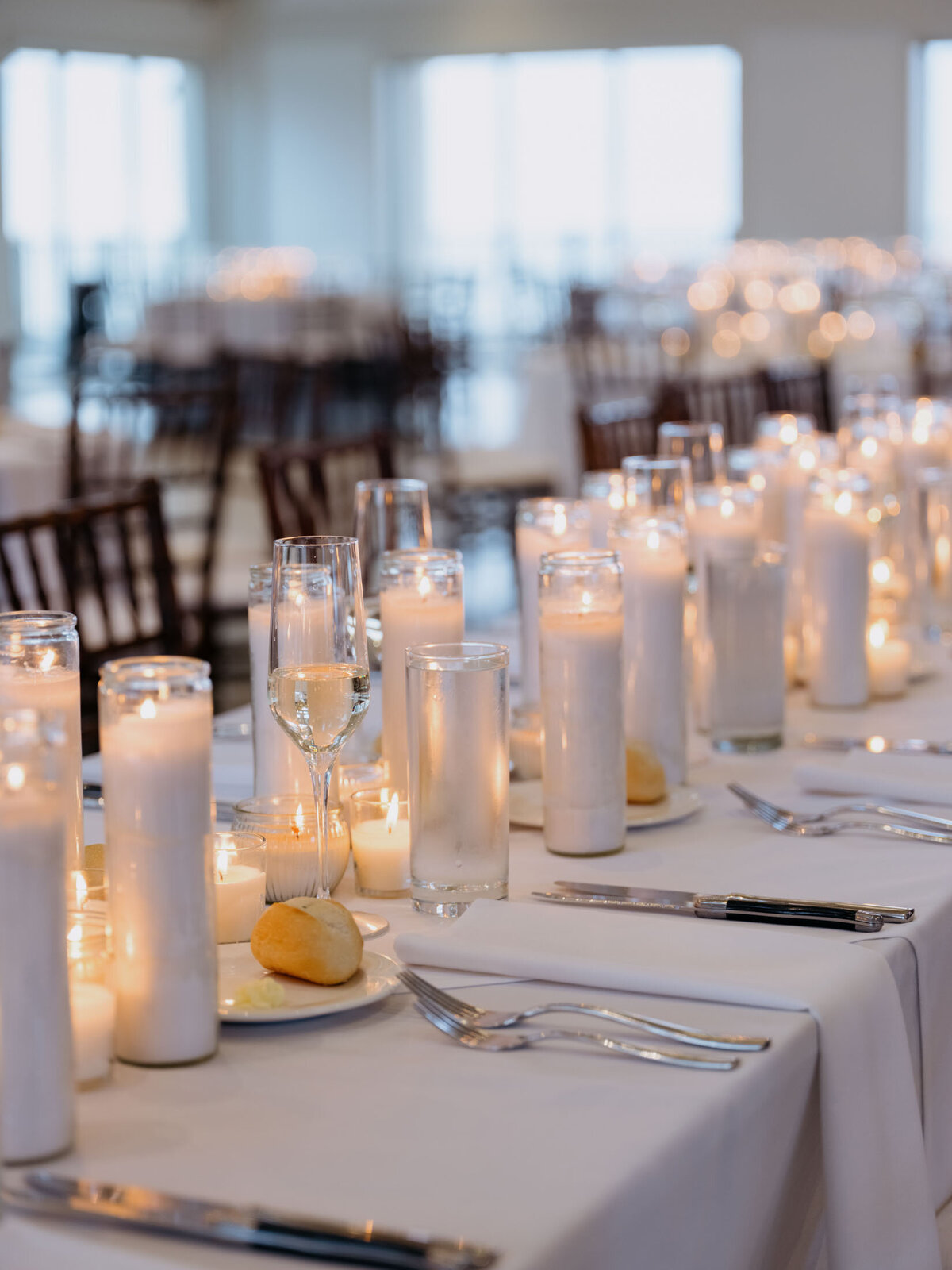 Wedding reception setup with candles inside Shoreby Club