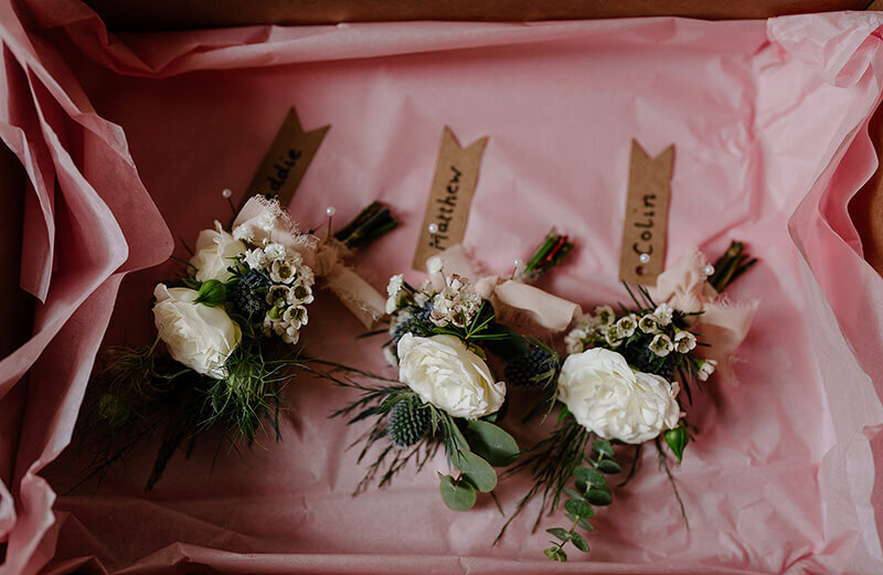 Grooms button hole flowers 86
