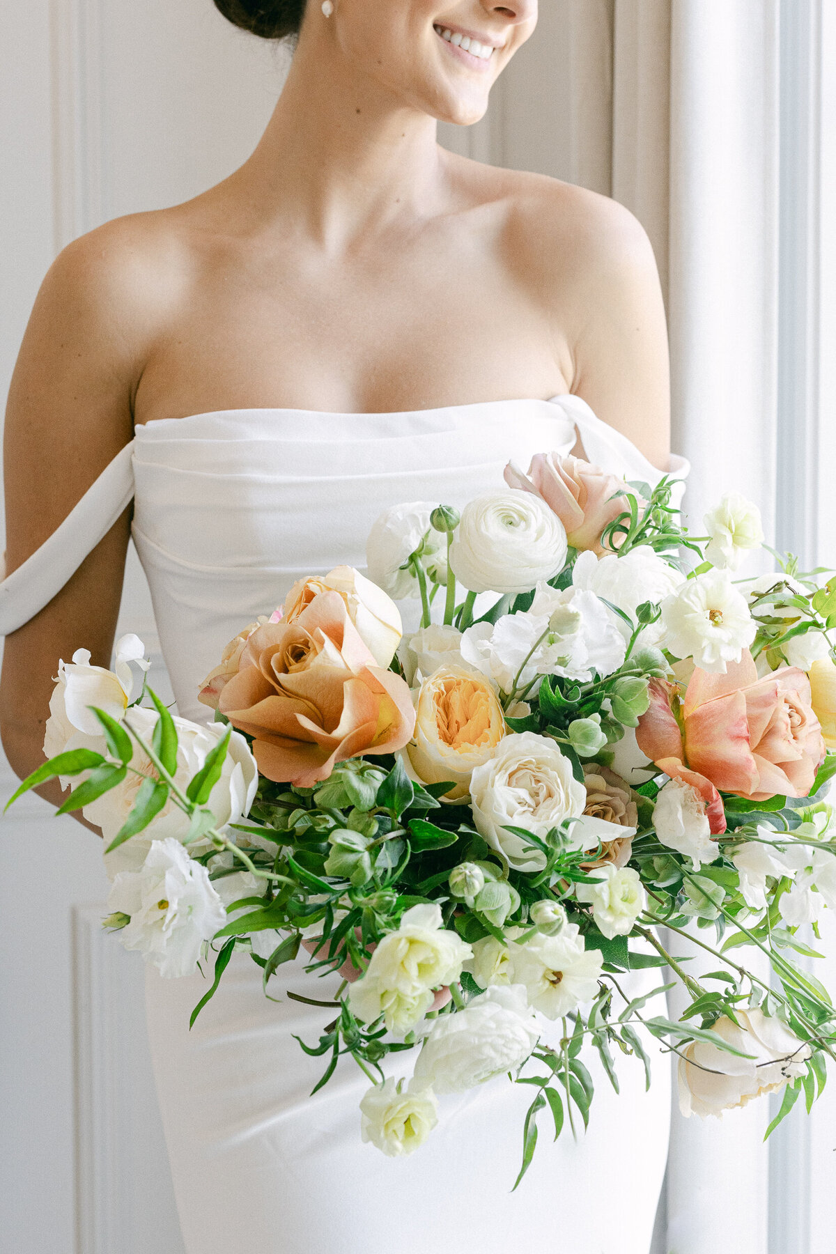 a bride holding a flower bouquet