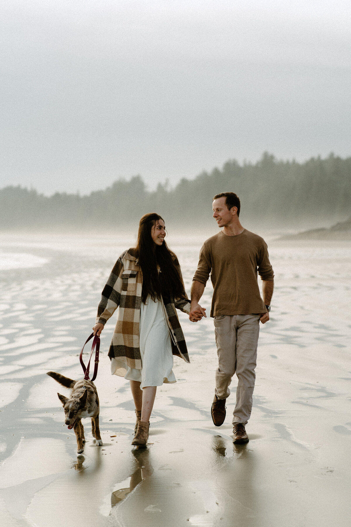 engagement photos walking your dog along the beach
