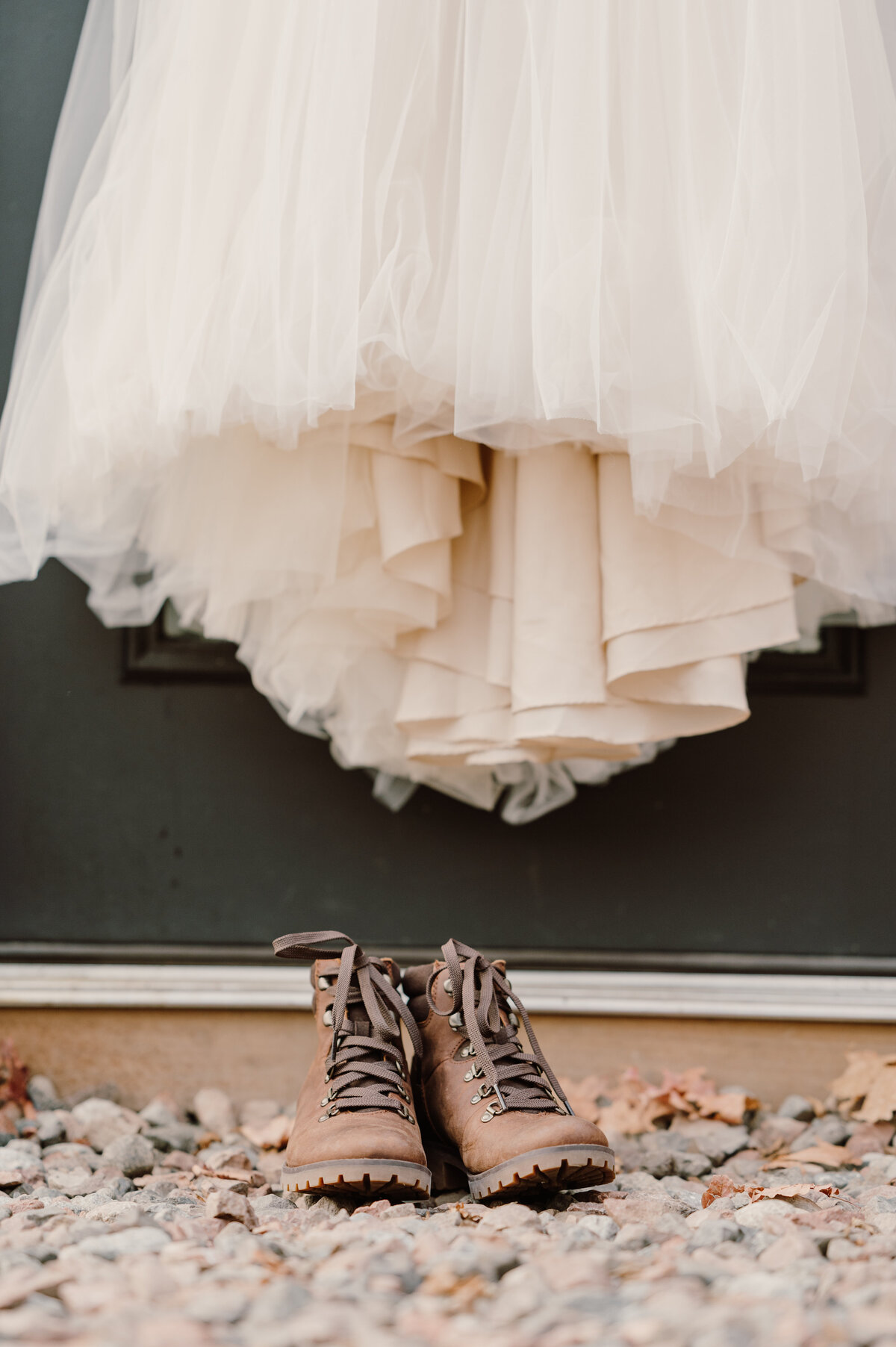 boot on the ground and the dress hanging on the door