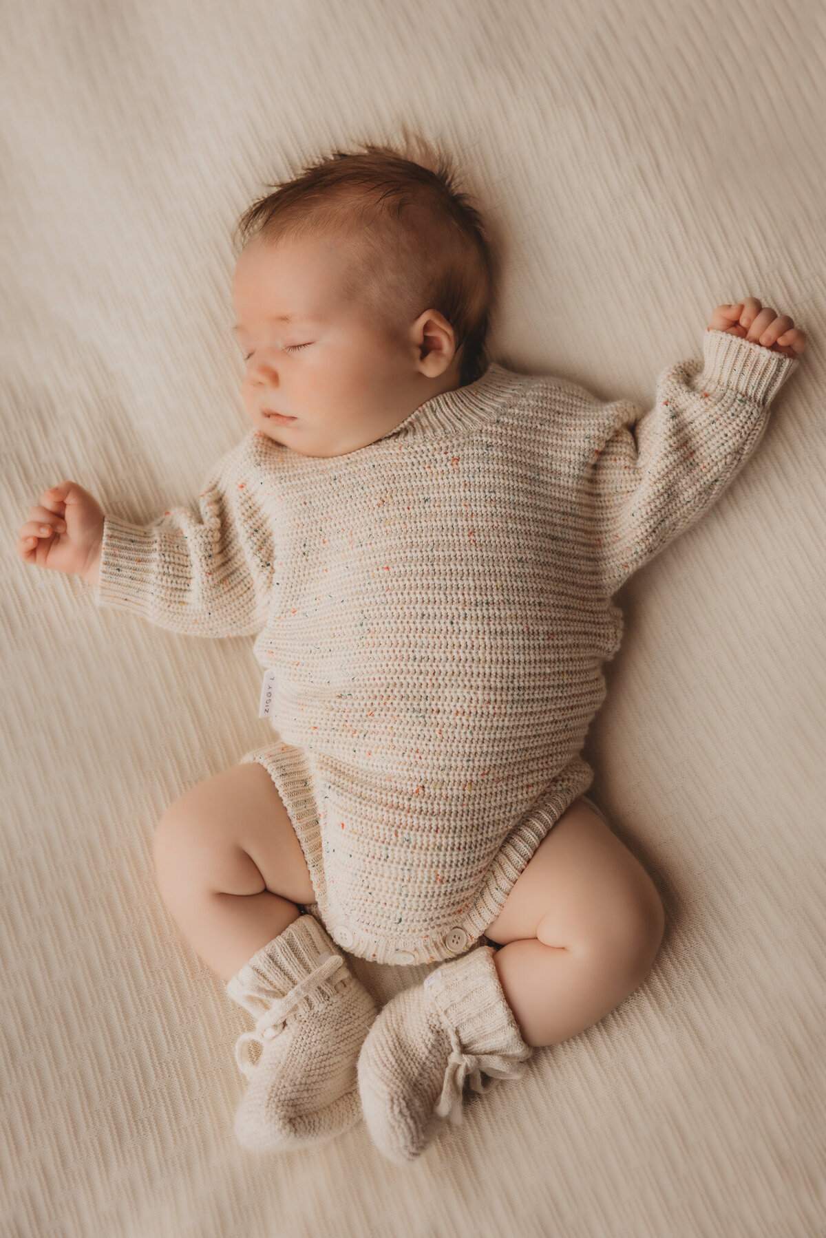 newborn baby posing during newborn photoshoot captured by Bie