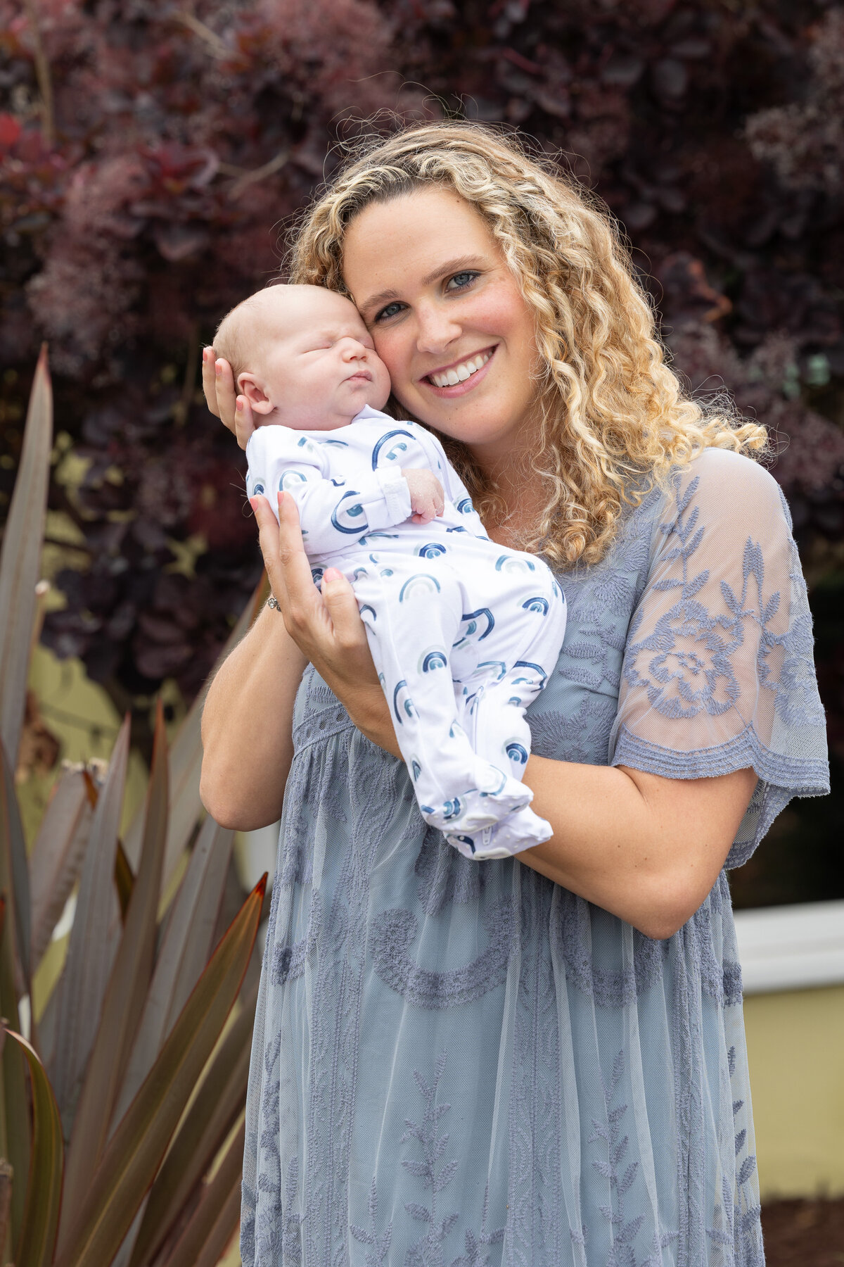 Young mother holding a baby boy