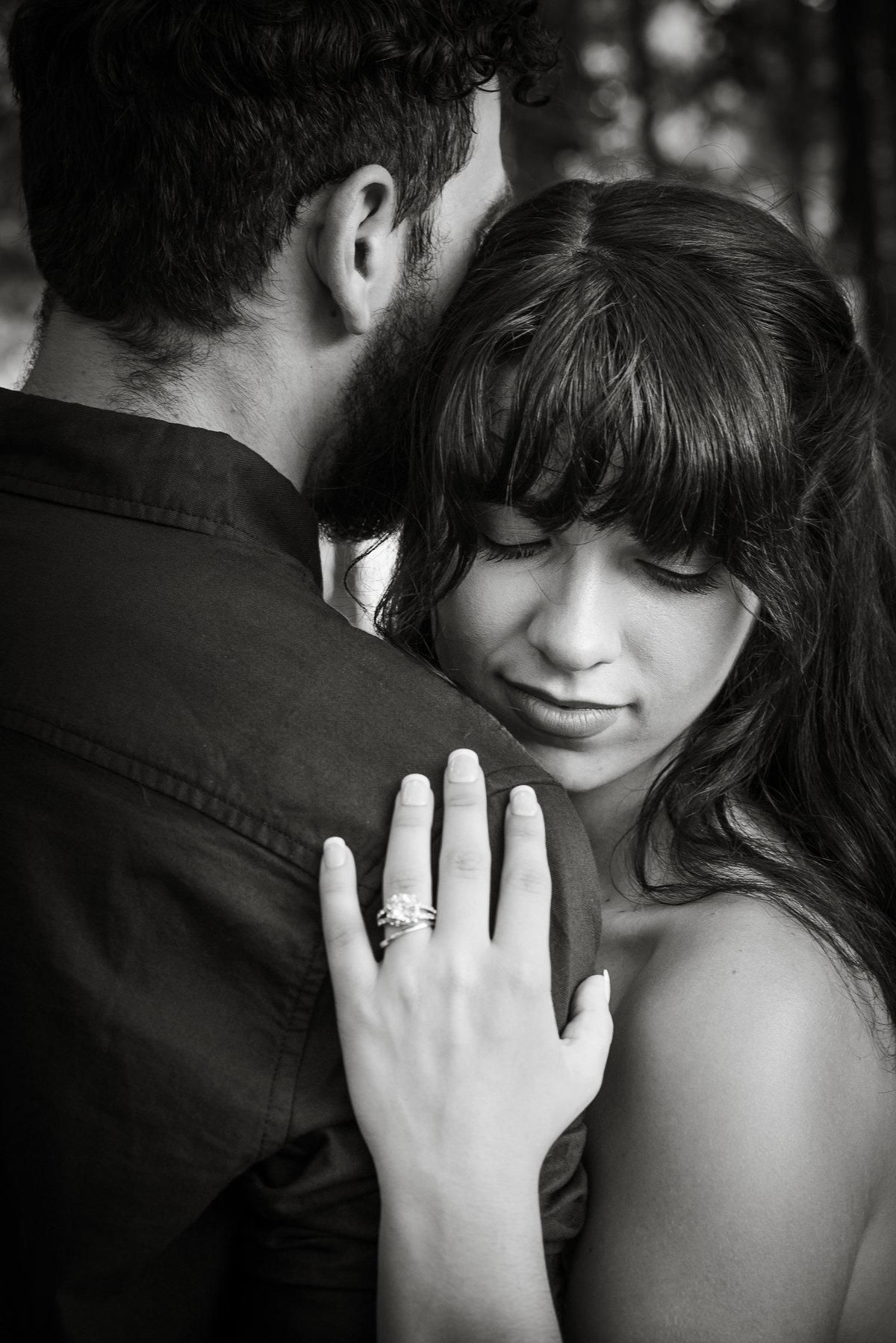 Black and white hands on shoulder