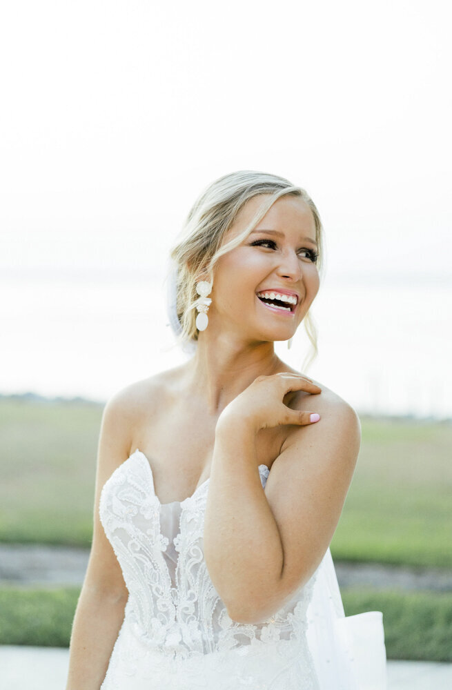 bride looking over her shoulder and laughing