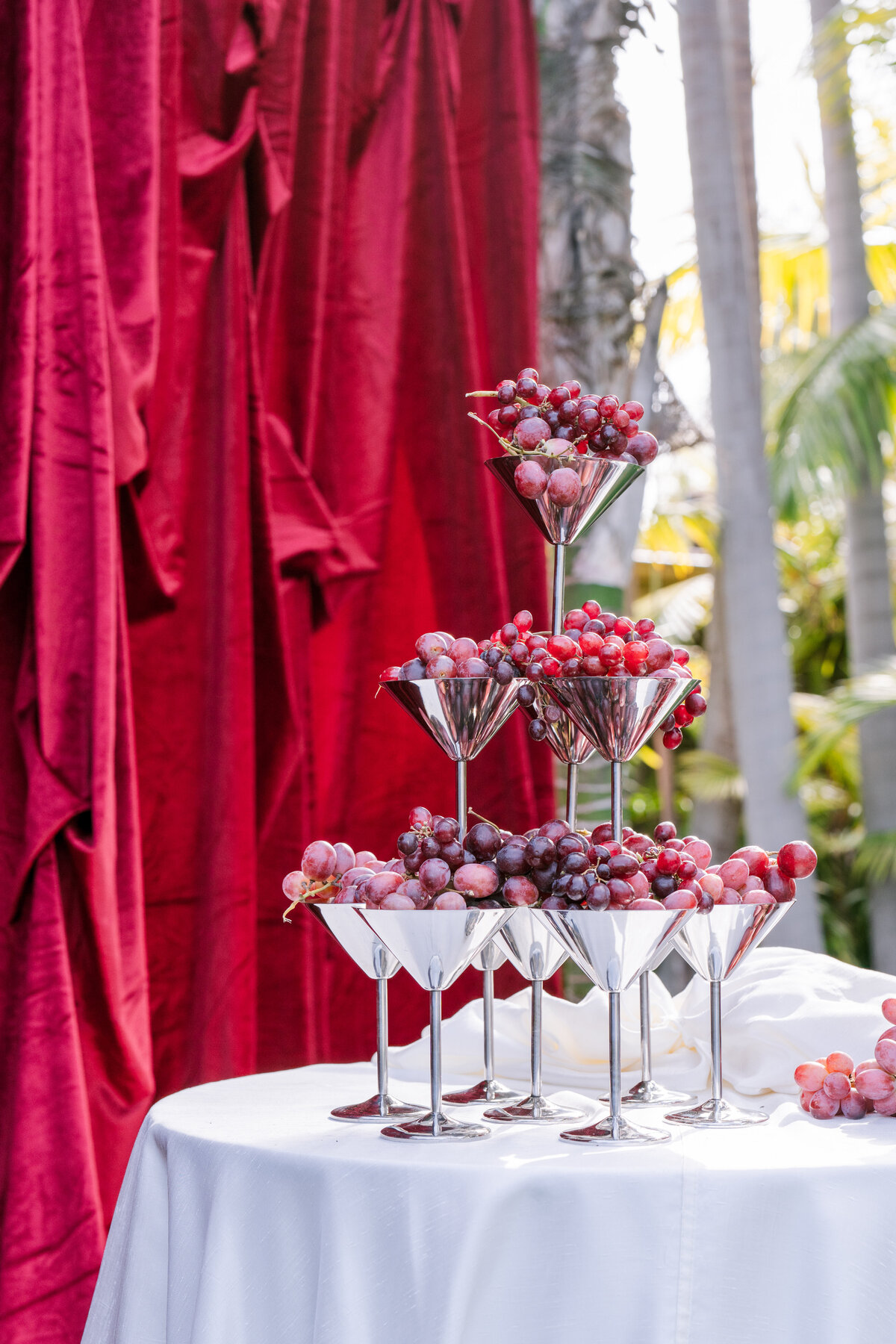 0008 California Wedding_Cherry Red Drapery and Fruit Tablescape_Photography by Emma