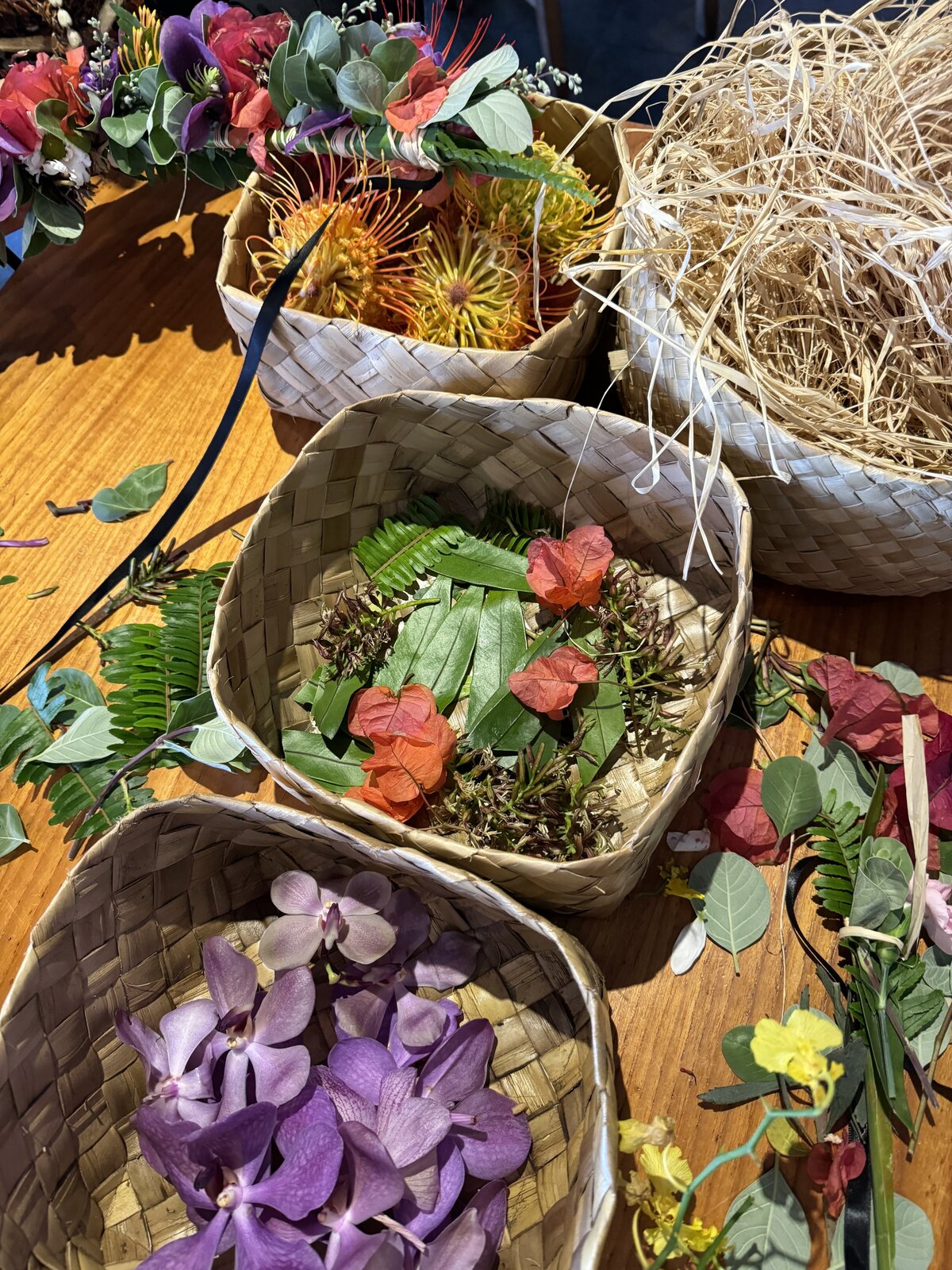 Baskets of petals, straw and leaves