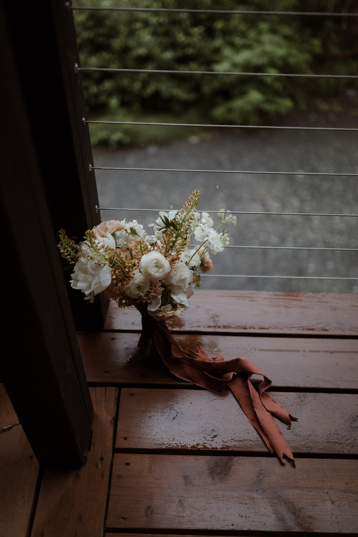 bouquet on rainy deck