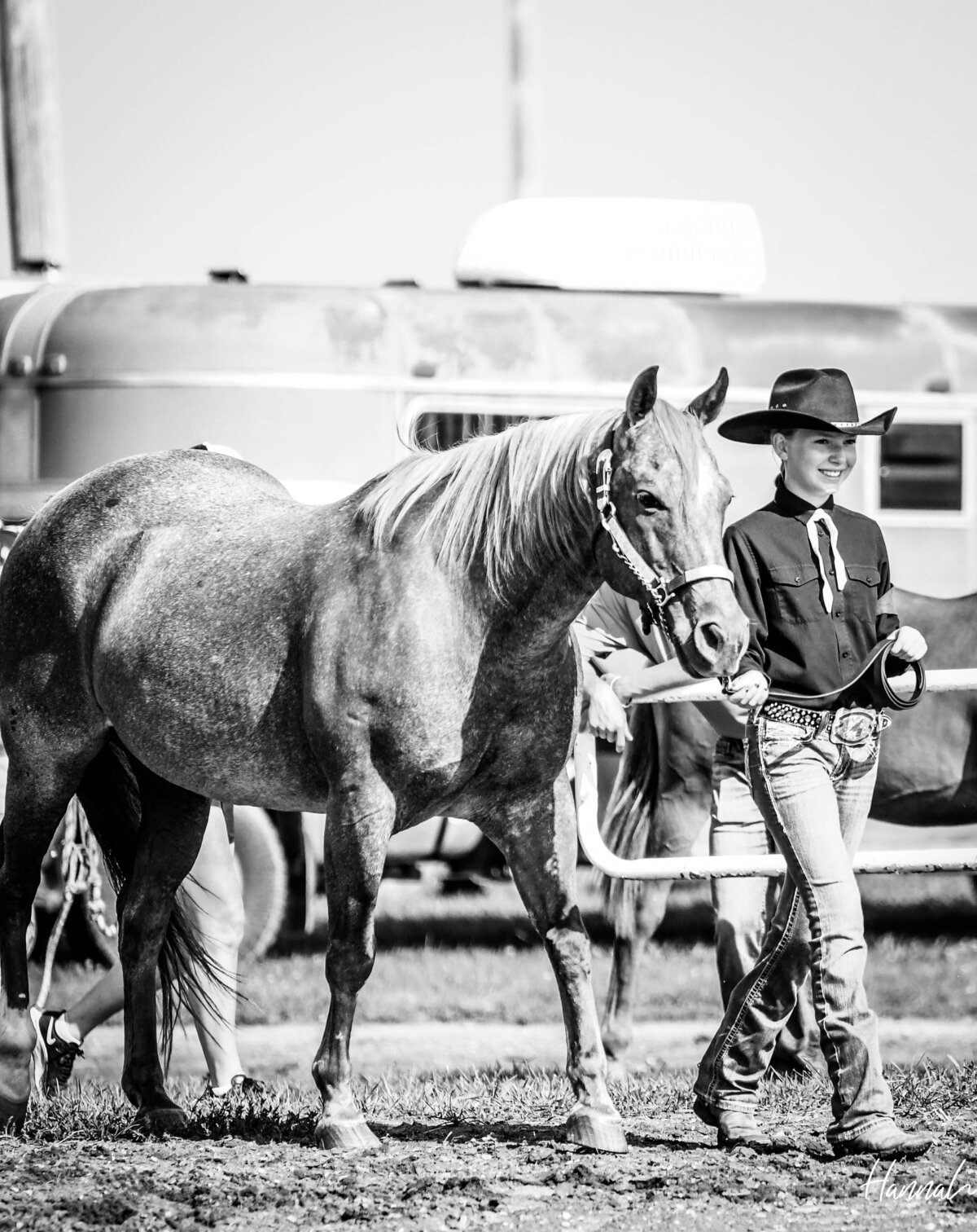 girl walking showing horse