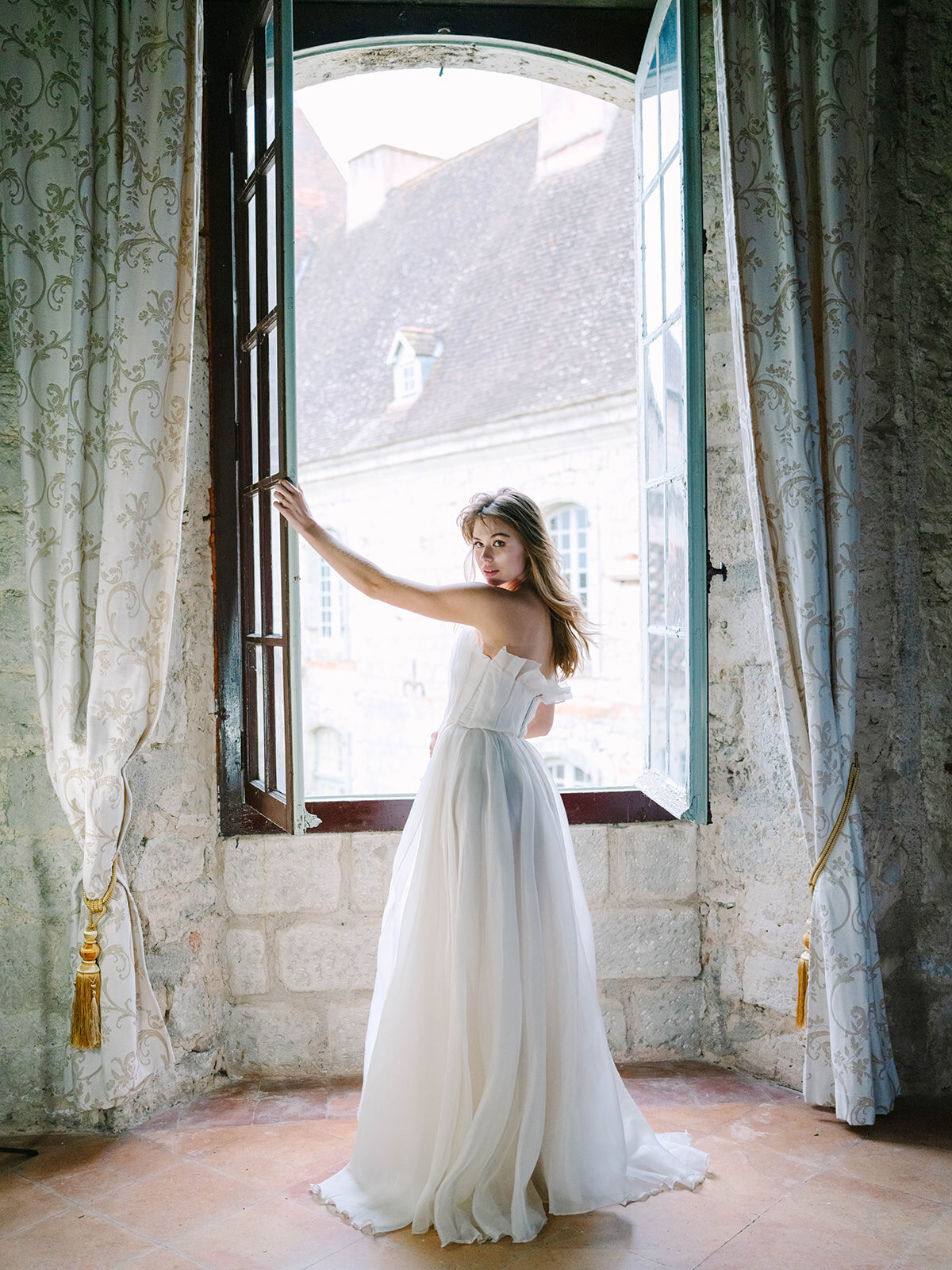 Bridal by window in  manor house