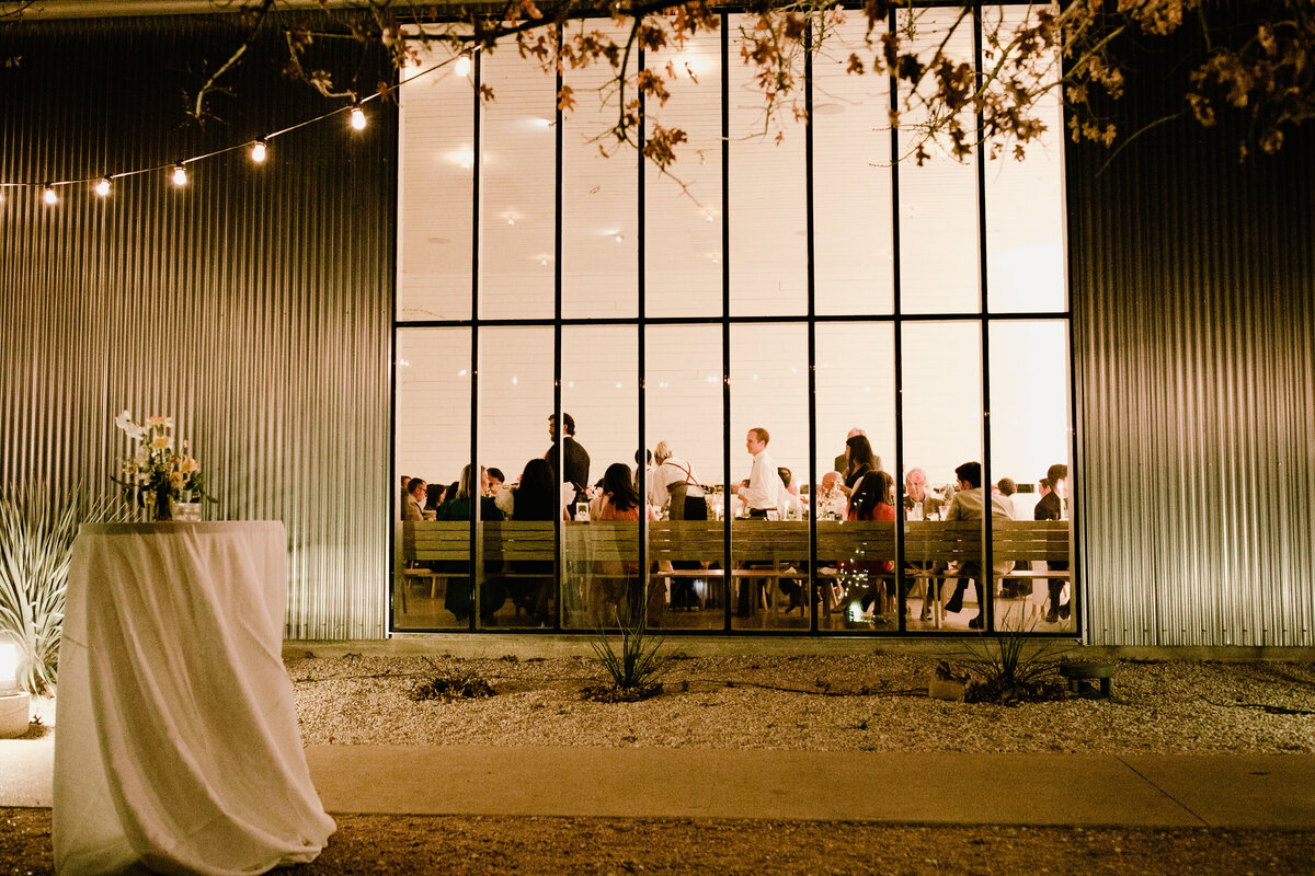 Outside view of large panel window at Prospect house wedding reception in Austin