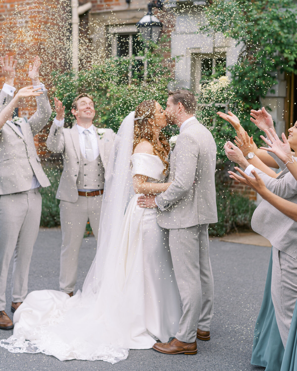 Bride and groom confetti at Lainston House wedding venue in Hampshire
