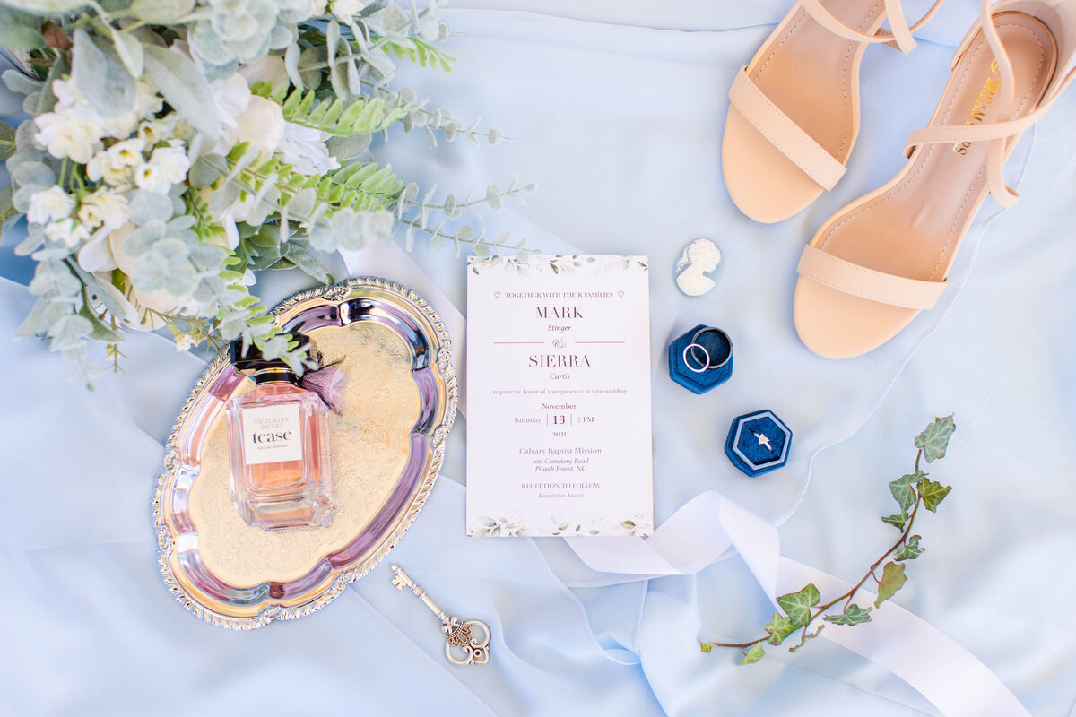 flat lay with blues, whites and greenery
