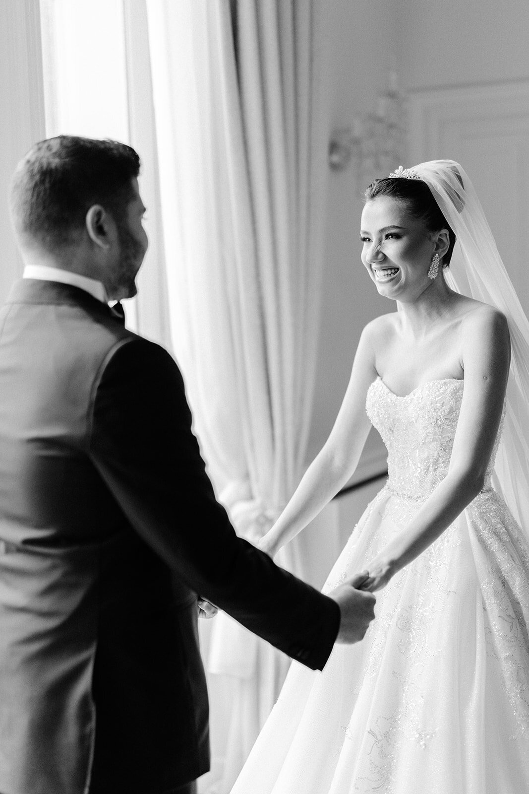 Bride and groom holding each other's hands